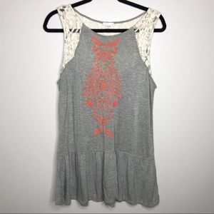 Ruffle hem tunic with embellishments and lace